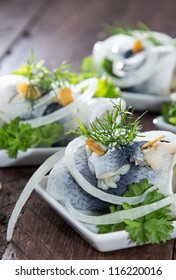 Herring Filet On Small Plates On Wooden Background