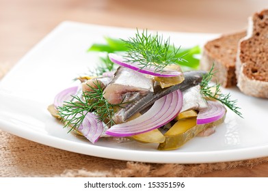 herring salad with pickled cucumbers and onions