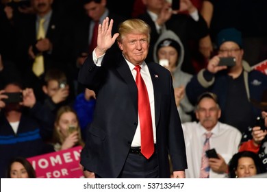 HERSHEY, PA - DECEMBER 15, 2016: President-Elect Donald Trump waves to the crowd as he arrives on stage to deliver a speech at a Thank You tour held at the Giant Center.