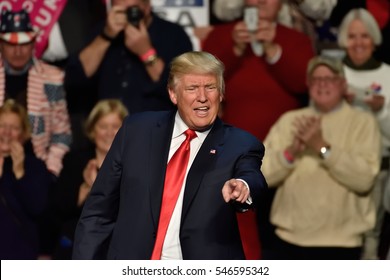 HERSHEY, PA - DECEMBER 15, 2016: President-Elect Donald Trump points straight toward the crowd as he concludes his speech at a "Thank You Tour" rally held at the Giant Center.