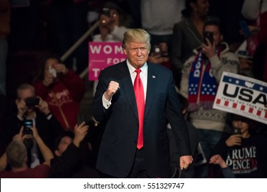 HERSHEY, PA - DECEMBER 15, 2016: President-Elect Donald Trump gives a "Fist Pump" to the crowd as he arrives on stage to deliver a speech at a "Thank You" Tour rally at the Giant Center.