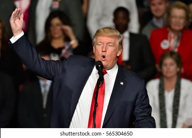 HERSHEY, PA - DECEMBER 15, 2016: President-Elect Donald Trump gestures with his right hand up during a speech to a large crowd at a "Thank You" Tour stop held at the Giant Center.