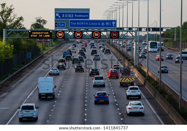 HERTFORDSHIRE, UK - MAY 26, 2019: Evening traffic on\
british motorway\
M1