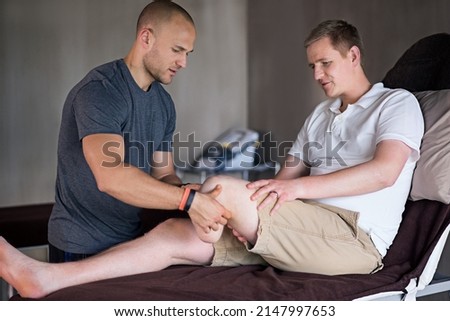 Hes an amazing physiotherapist. Shot of a physiotherapist examining a man with an amputated leg. Foto d'archivio © 
