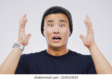 Hes Completely Blown Away. Studio Portrait Of A Handsome Young Man Looking Shocked Against A Grey Background.