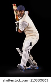Hes got some talent with the bat. A cropped shot of an ethnic young man in cricket attire isolated on black.