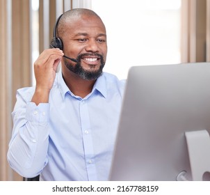 Hes Here To Help You With Anything. Shot Of A Young Male Call Center Agent At Work.