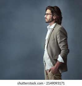 Hes a man of class. Cropped studio shot of a handsome and stylish young man against a grey background. - Shutterstock ID 2149093171