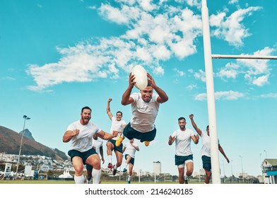 Hes the man of the match. Shot of a rugby player scoring a try while playing on a field. - Powered by Shutterstock