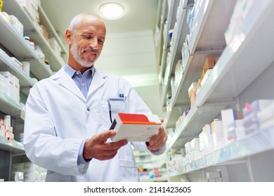 Hes Meticulous When It Comes To Medicinal Management. Shot Of A Mature Pharmacist Doing Inventory In A Pharmacy.