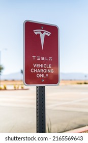 Hesperia, California, USA-October 12, 2021 - Tesla supercharging station during the day.