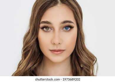 heterochromia in an attractive Caucasian young woman. face close-up, portrait of a beautiful woman with eyes of different colors of blue and brown. melanin, genetics - Powered by Shutterstock