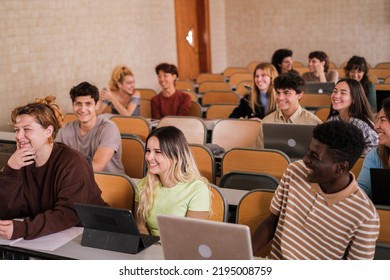 Heterogeneous group of students paying attention to university classes - Shutterstock ID 2195008759