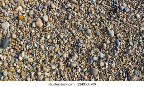heterogeneous texture of stones and sand background - Shutterstock ID 2240530789