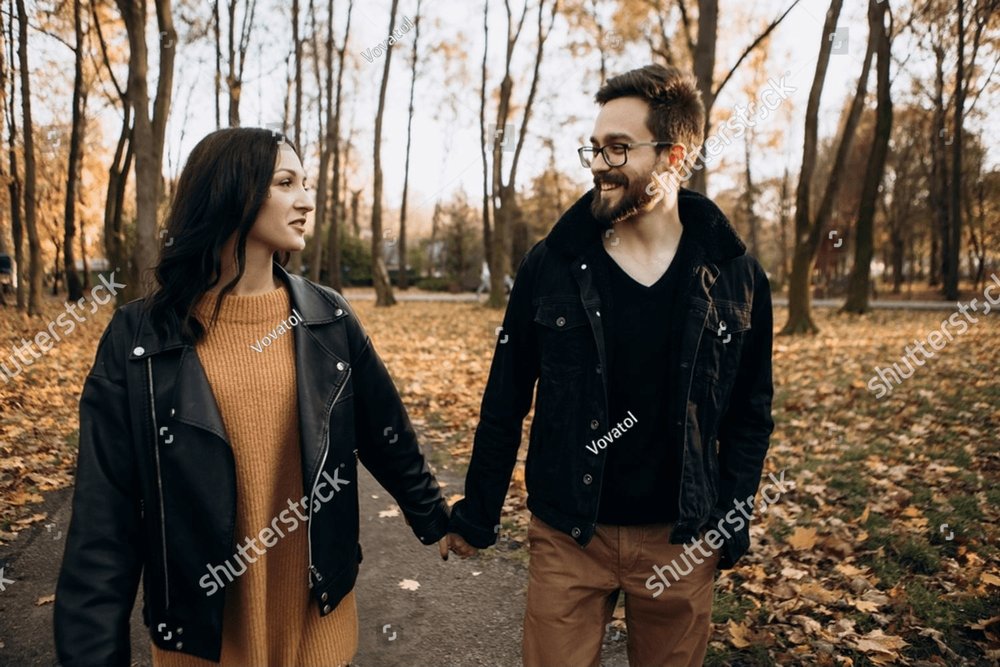 Heterosexual caucasian young loving couple walking outside in the city ...