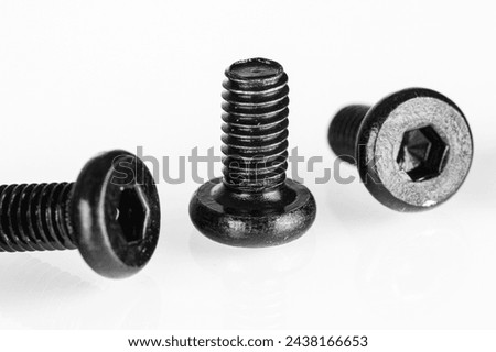 hex socket head screw in black color on isolated white background close up