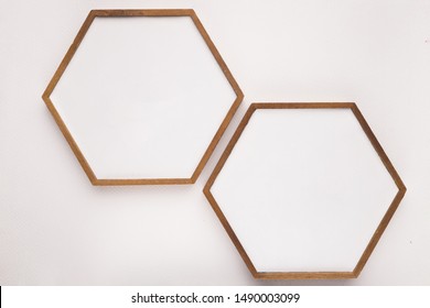 Hexagon Wooden Frame On White Backdrop
