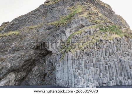 Hexagonal basalt columns outside Halsanefshellir cave on the Reynisfjara black sand beach on Iceland's South Coast
