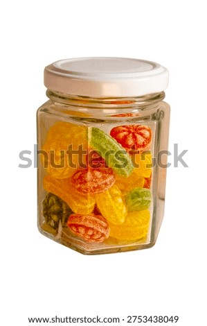Hexagonal glass jar filled with assorted colorful hard candy sweet