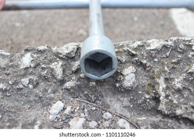 Hexagonal head of car key to install the wheels. Close up