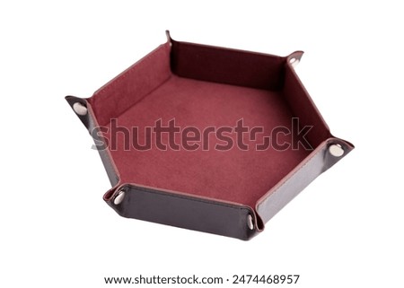 Hexagonal leather dice tray with red interior, isolated on a white background. Gaming accessory