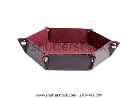 Hexagonal leather dice tray with red interior, isolated on a white background. Gaming accessory