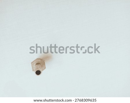 Hexagonal Metal Nut,This image features a close-up of a hexagonal metal nut,showcasing its threaded design.