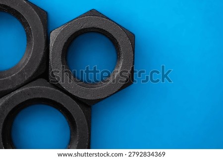 Hexagonal nuts on a blue background