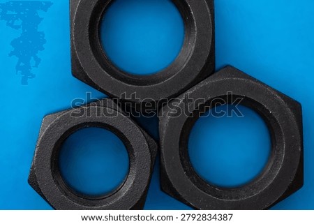 Hexagonal nuts on a blue background