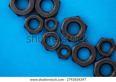 Hexagonal nuts on a blue background
