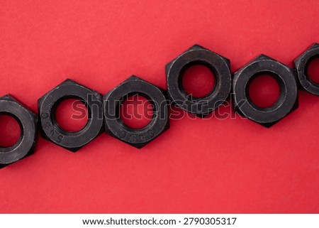 Hexagonal nuts on a colored background