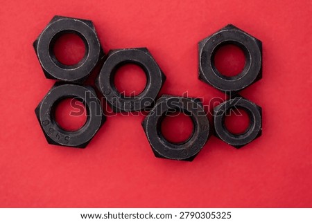 Hexagonal nuts on a colored background