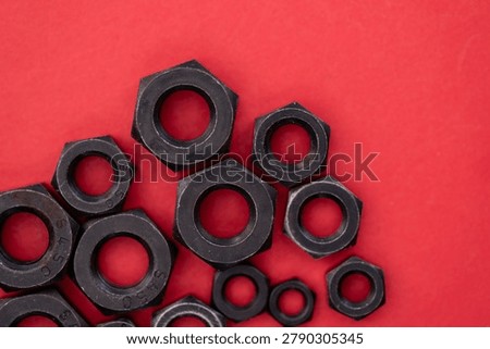 Hexagonal nuts on a colored background