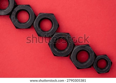 Hexagonal nuts on a colored background