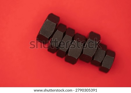 Hexagonal nuts on a colored background