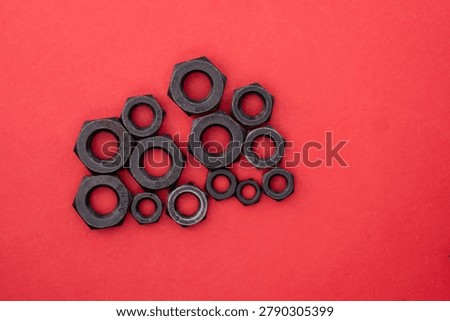 Hexagonal nuts on a colored background