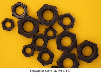 Hexagonal nuts on a yellow background