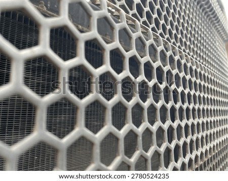 Hexagonal Patterned Metal Grid Texture Detail on Industrial Machinery