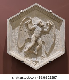 Hexagonal relief of Daedalus working with tools, symbolizing mechanical arts, by Andrea Pisano, Campanile di Giotto, Florence, Italy, 14th-century sculpture.