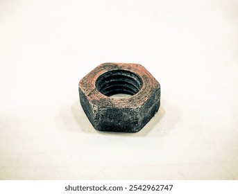 Hexnut is isolated on a plain white background. Old hexnut.