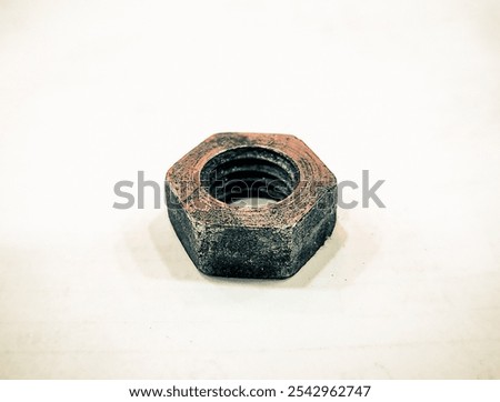 Hexnut is isolated on a plain white background. Old hexnut.