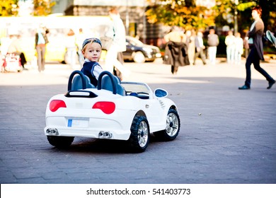 Hey, What Is There? Cute Little Boy Drives His First Car