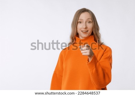 Hey you. Portrait of beautiful cheerful young woman pointing finger at camera and smiling, congratulating you, praising or inviting. You got this
