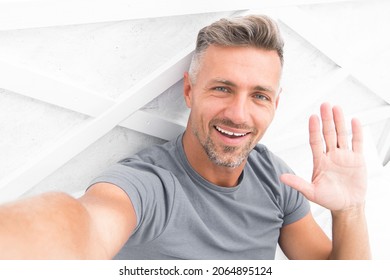 Hi There. Man Taking Selfie Photo Smartphone Waving Hand. Streaming Online Video. Mobile Internet. Shooting For Blog. Mature Man Blogger. Blog Online Content. Personal Blog Concept. Good Morning