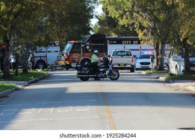 Hialeah, FL, USA: February 26, 2021: Hialeah Police Officers And Fire Fighters Arrive To A Halt Of A Car Chase Crime Scene Where They Blocked Off Many Streets. Miami Dade County. 