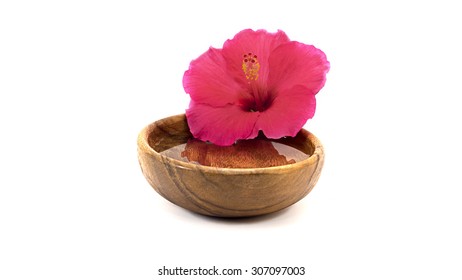 Hibiscus Flower Macro In Wooden Plate With Water Isolated On White Background