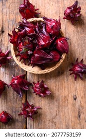 Hibiscus sabdariffa or roselle fruits on wooden background