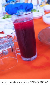 Hibiscus Tea: on Table with Orange Table Cloth