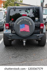 HICKORY, NC, USA-10/14/18: The Rear Spare Tire Cover On A Jeep Has Image Of Us Flag And The Words 