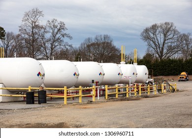 HICKORY, NC, USA-2/1/19: A Line Of Large Propane Storage Tanks And A Propane Delivery Truck Owned By James Oxygen.